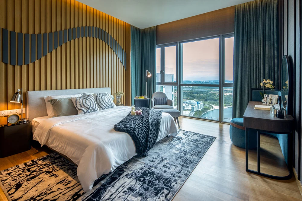 Master bedroom with a wave-patterned feature wall and marina view at Southern Marina Residences